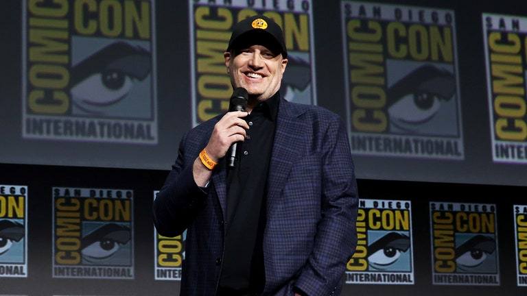 Kevin Feige speaking on stage at Comic Con